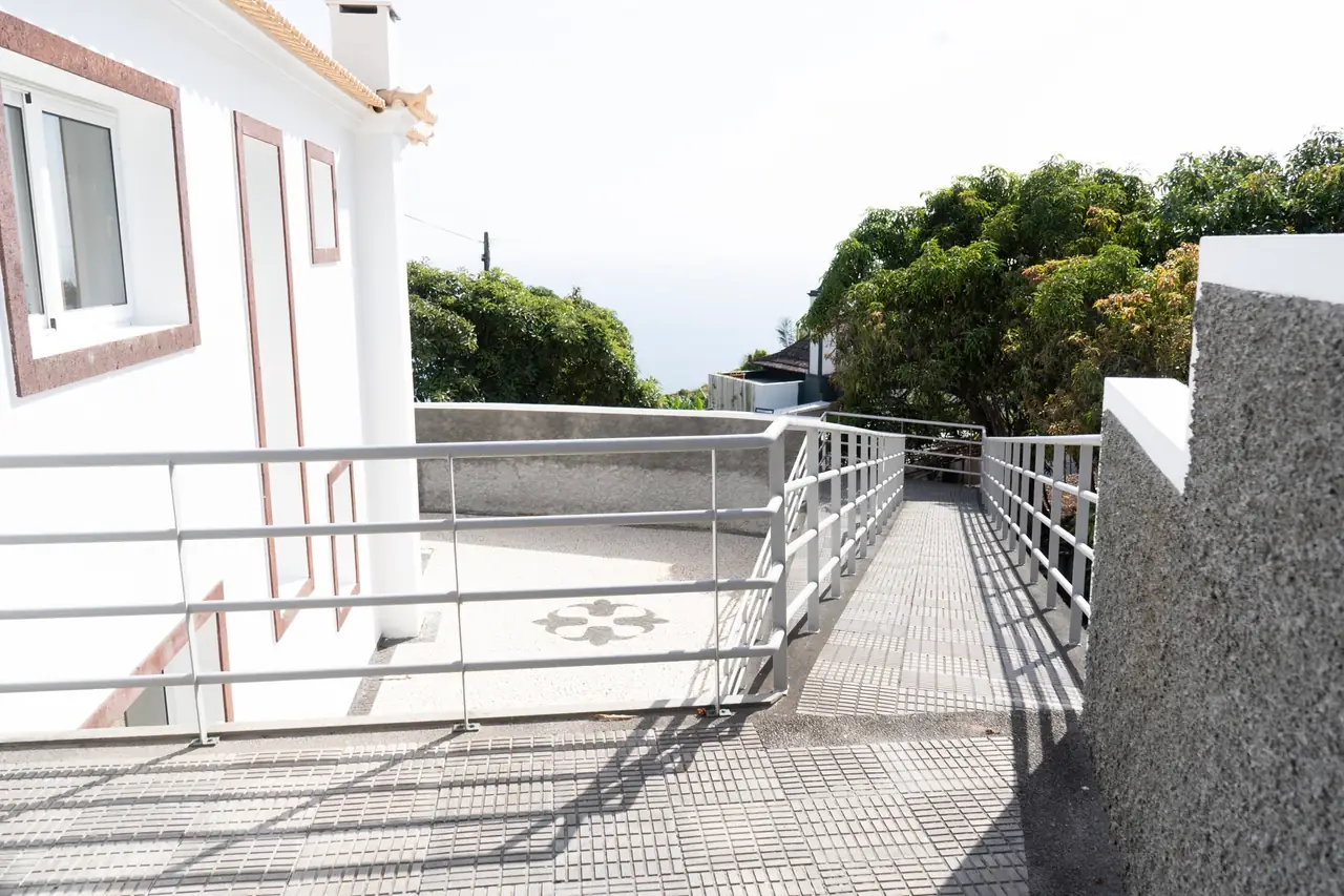 Private terrace of the accessible bedroom with sea glimpse, Villa Crossdeira, Arco da Calheta
