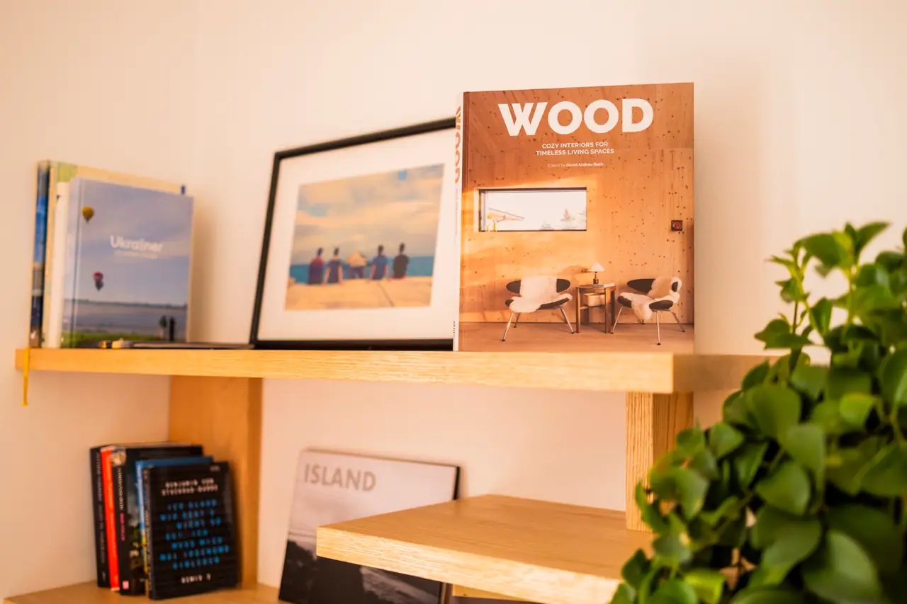 Coffee-table books and framed photos on the living room shelf, Villa Crossdeira