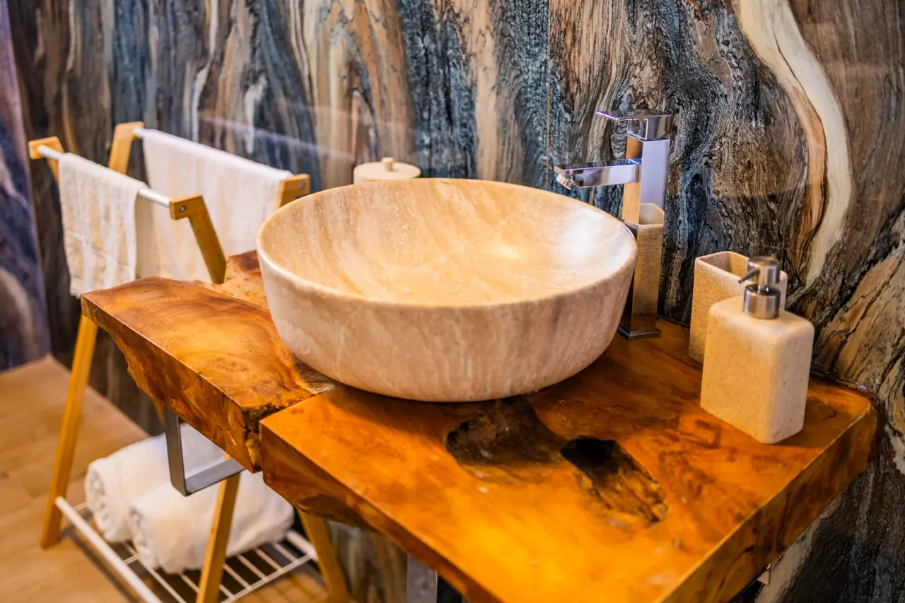 Stone washbasin on a live-edge wooden counter, Ocean Bedroom bathroom, Villa Crossdeira