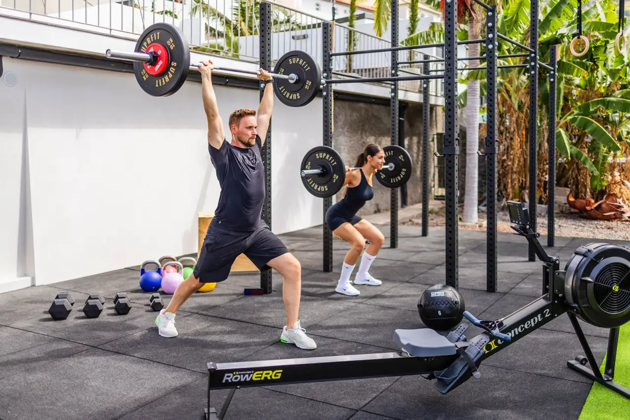 Barbell overhead press in the outdoor gym, Villa Crossdeira Madeira